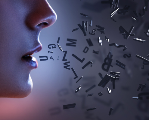The image features a gradient background transitioning from a reddish hue on the left to a bluish hue on the right. On the right side, there are numerous black letters and symbols scattered and floating in mid-air, creating an abstract effect. The letters vary in orientation and size, giving a sense of motion or dispersion. There isn't any visible text or math problems in this image.